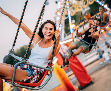 Smiling woman on swing ride